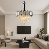 Candelabru rotund argintiu cu accente aurii și cristale, devenind punctul central luminos al unui living modern și spațios.