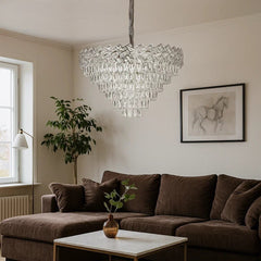 Candelabru rotund din cristal Ø600 mm, cu 9 surse E27, montat central intr-un living mare cu efect vizual spectaculos